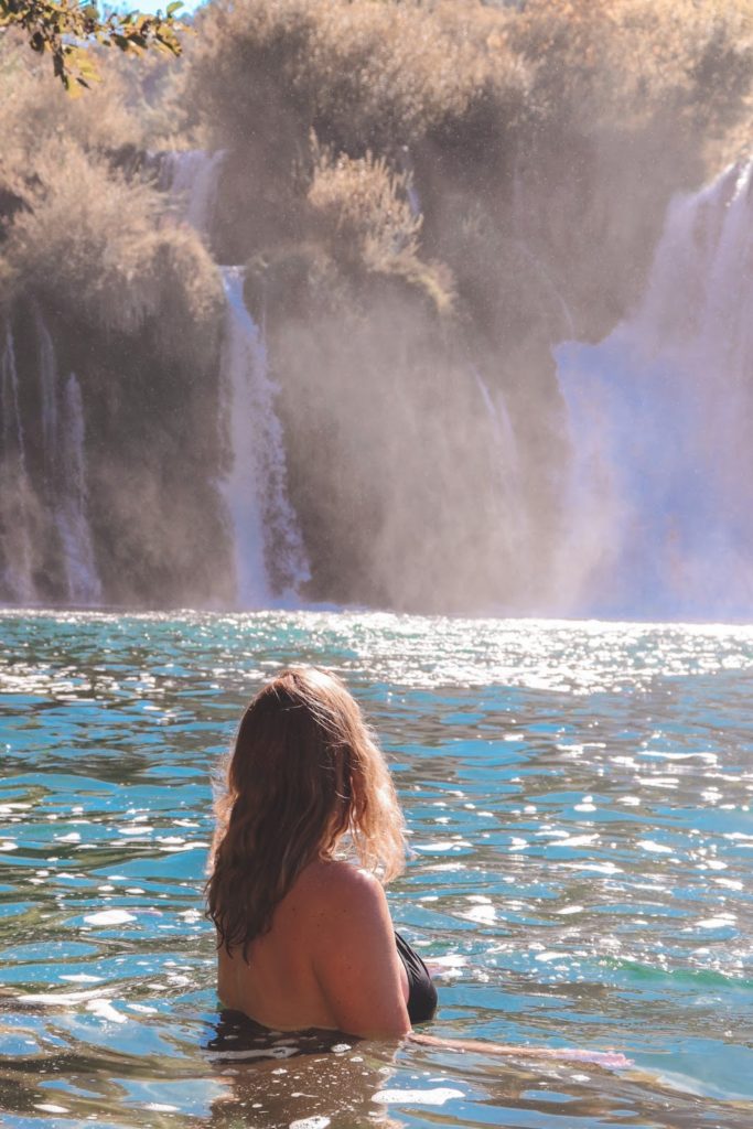 woman in waterfall croatia